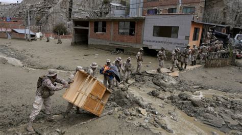 cleaning mud Bolivia|Bolivia landslides, flooding destroy homes .